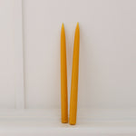 100% Beeswax hand-dipped dinner taper candles. Burn-time of up to 12 hours, 33cm long, weighs 180g.