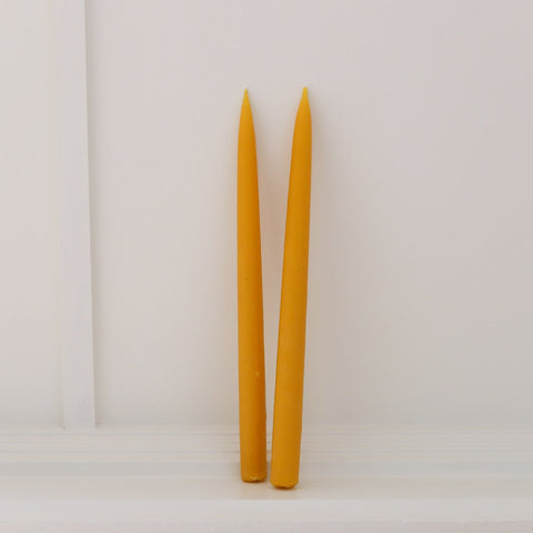 100% Beeswax hand-dipped dinner taper candles. Burn-time of up to 12 hours, 33cm long, weighs 180g.
